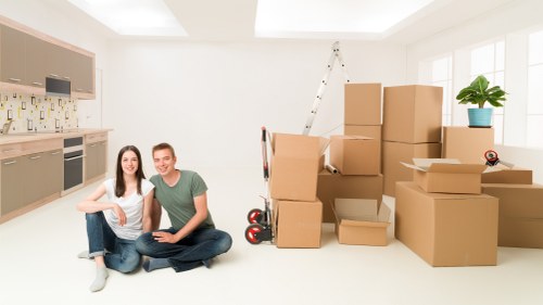 Professional office relocation setup with desks and monitors in Hampton
